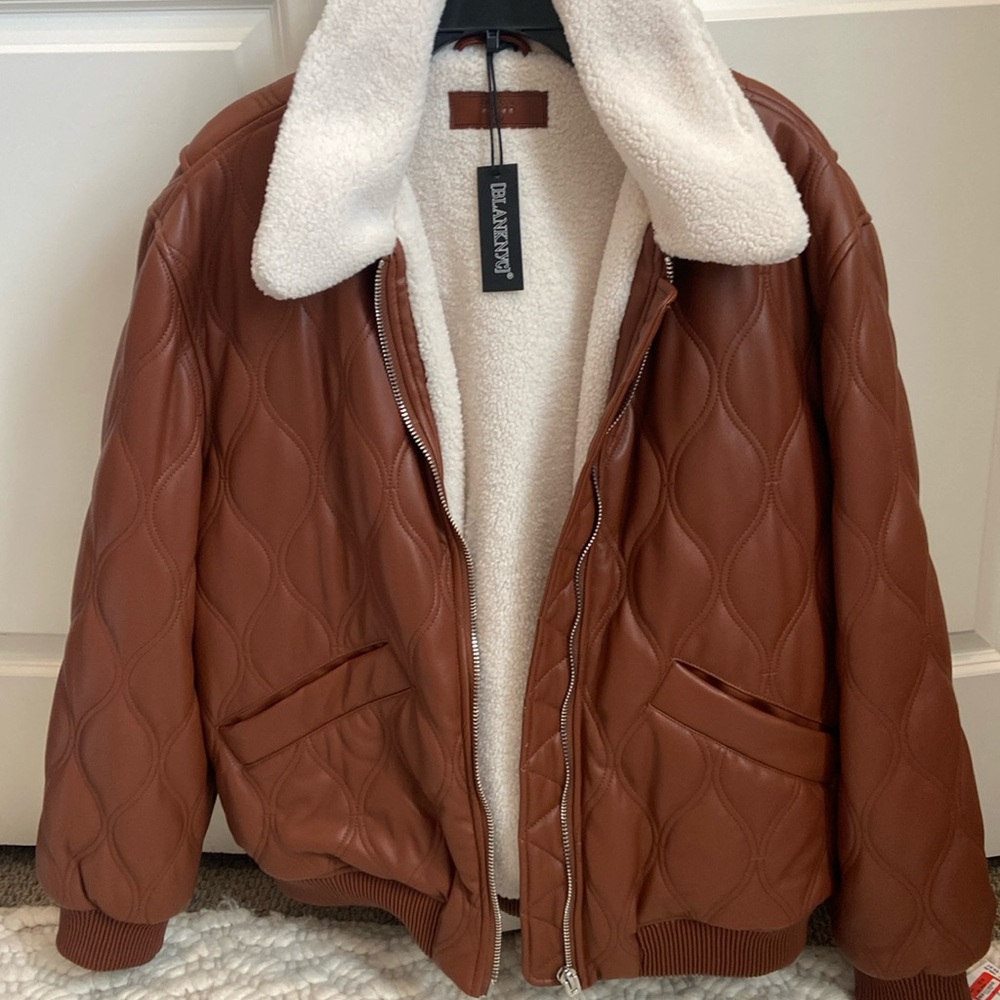 BlankNyc XL Sherpa lined polyester jacket in a rust color.